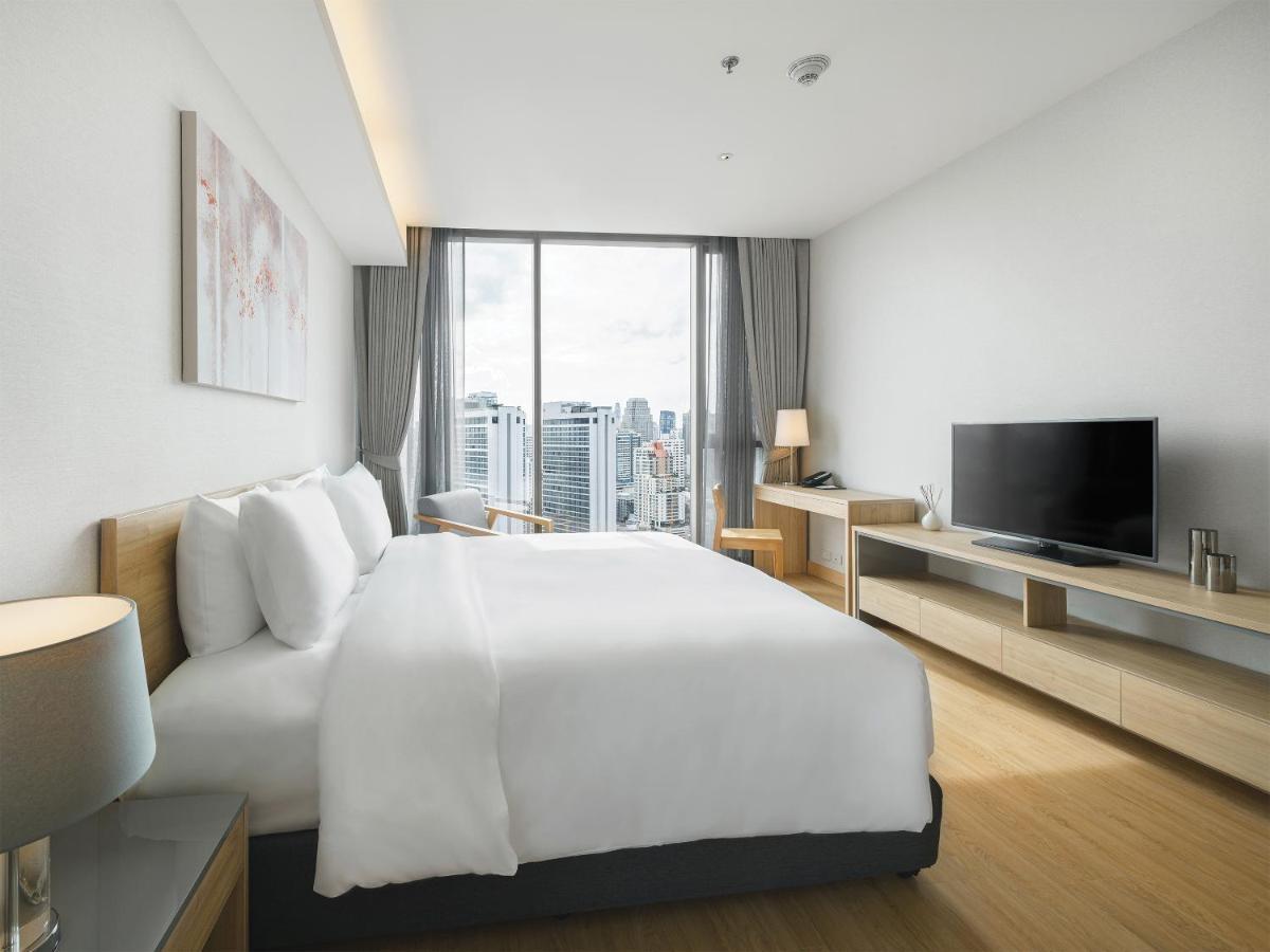 Oakwood Suites Bangkok Banguecoque Exterior foto Deluxe Room