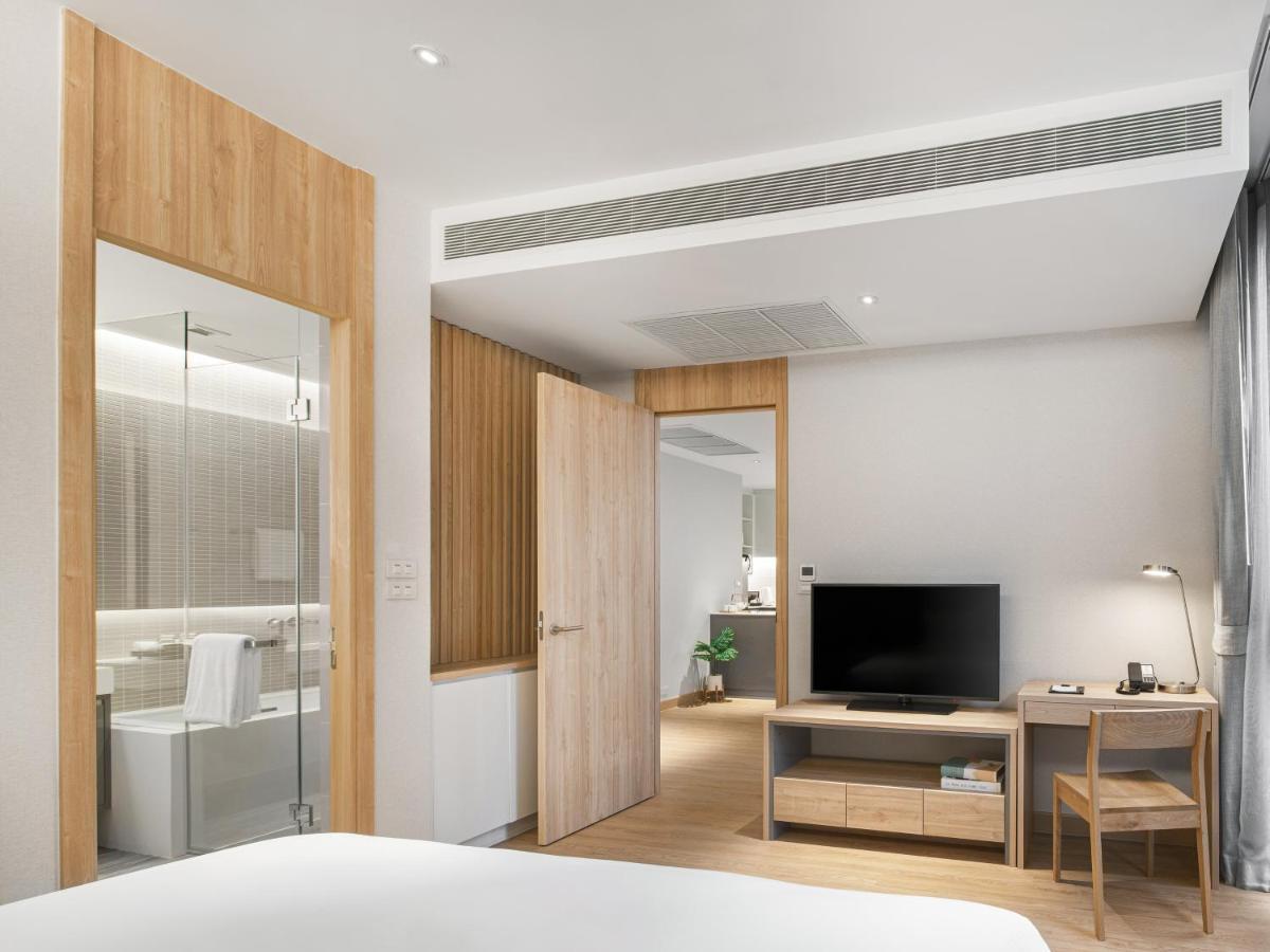 Oakwood Suites Bangkok Banguecoque Exterior foto Deluxe Room