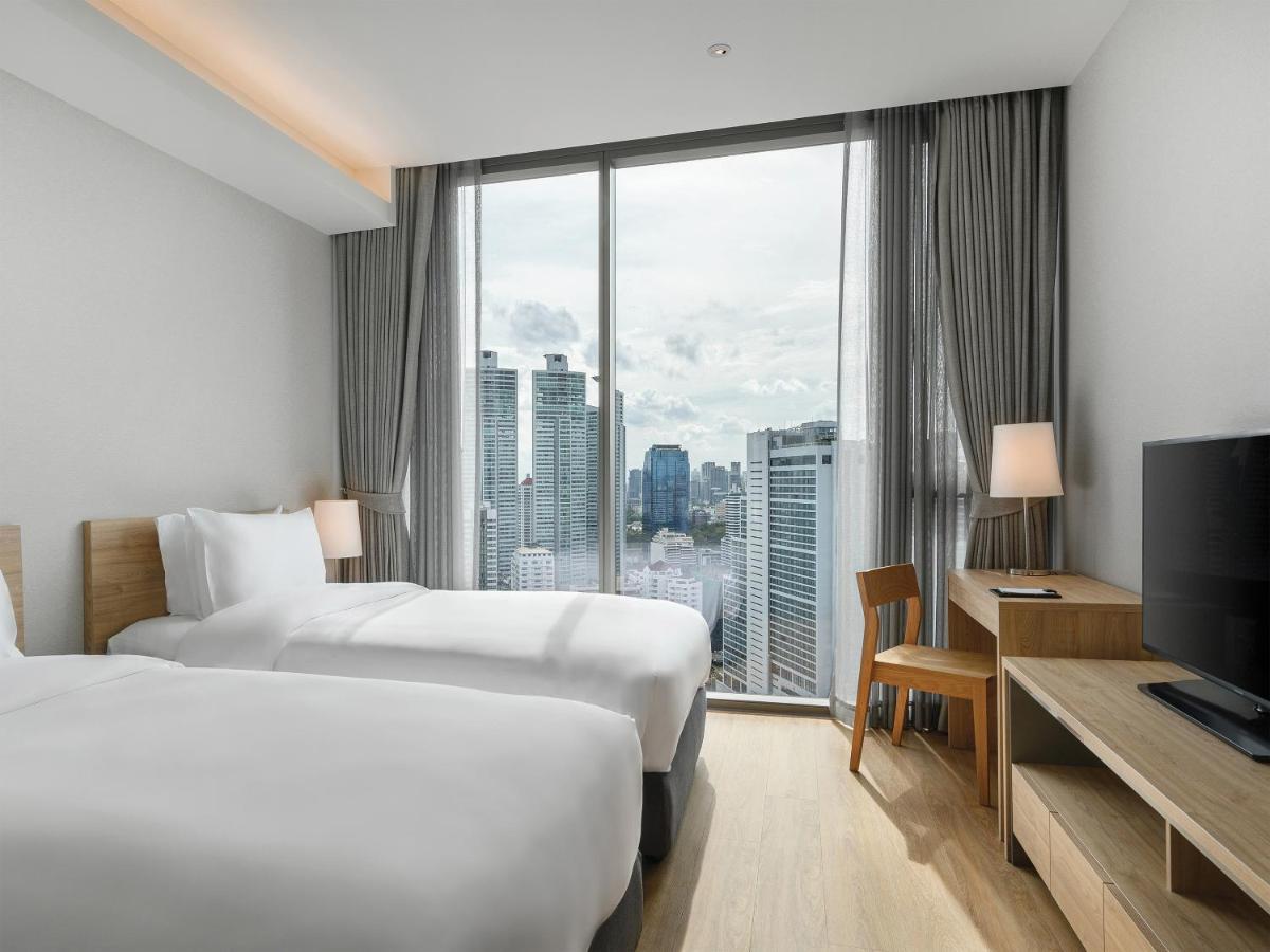 Oakwood Suites Bangkok Banguecoque Exterior foto Deluxe Room