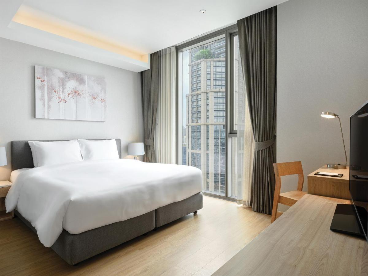 Oakwood Suites Bangkok Banguecoque Exterior foto Deluxe Room