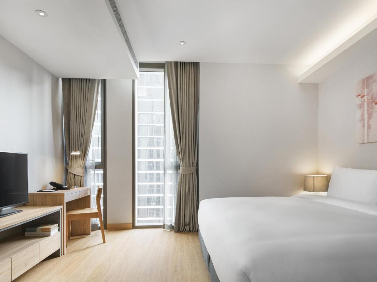 Oakwood Suites Bangkok Banguecoque Exterior foto Deluxe Room