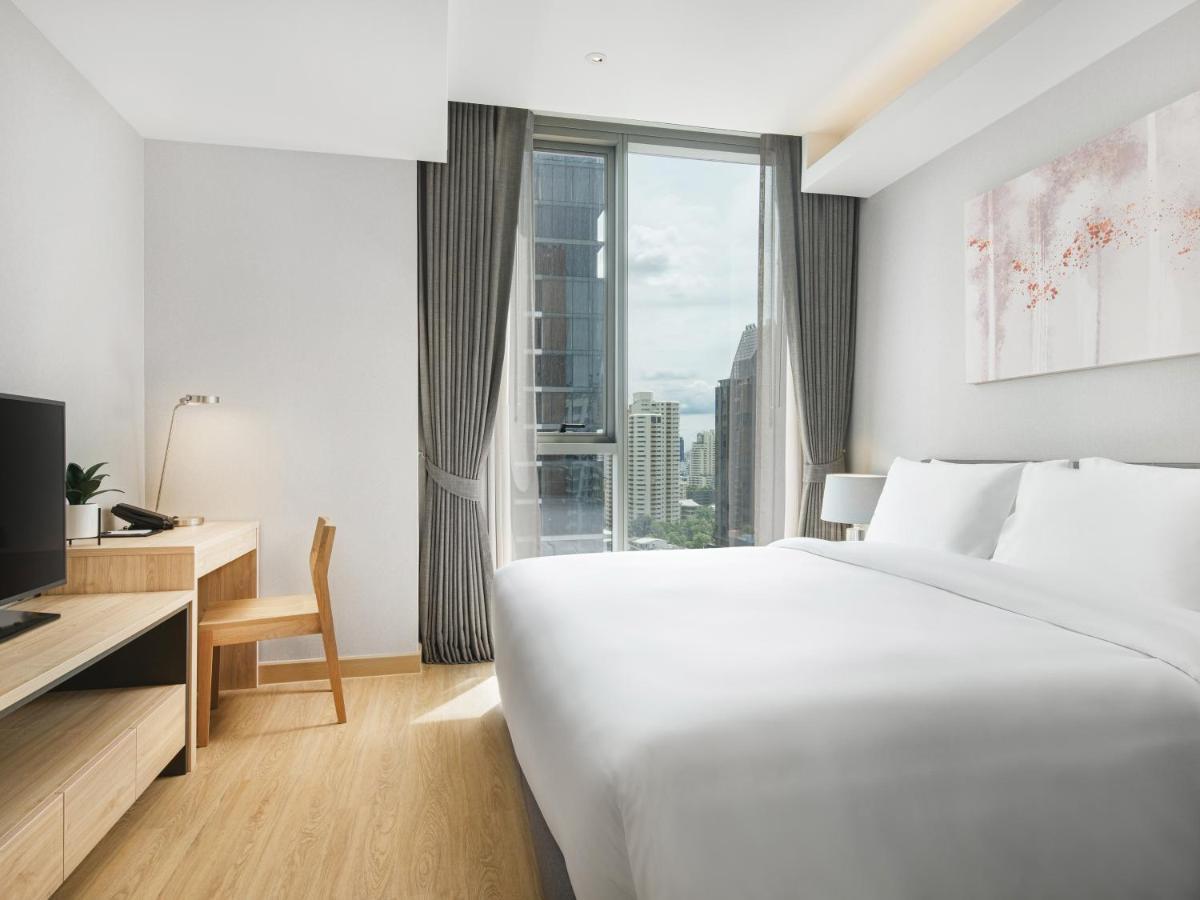 Oakwood Suites Bangkok Banguecoque Exterior foto Deluxe Room