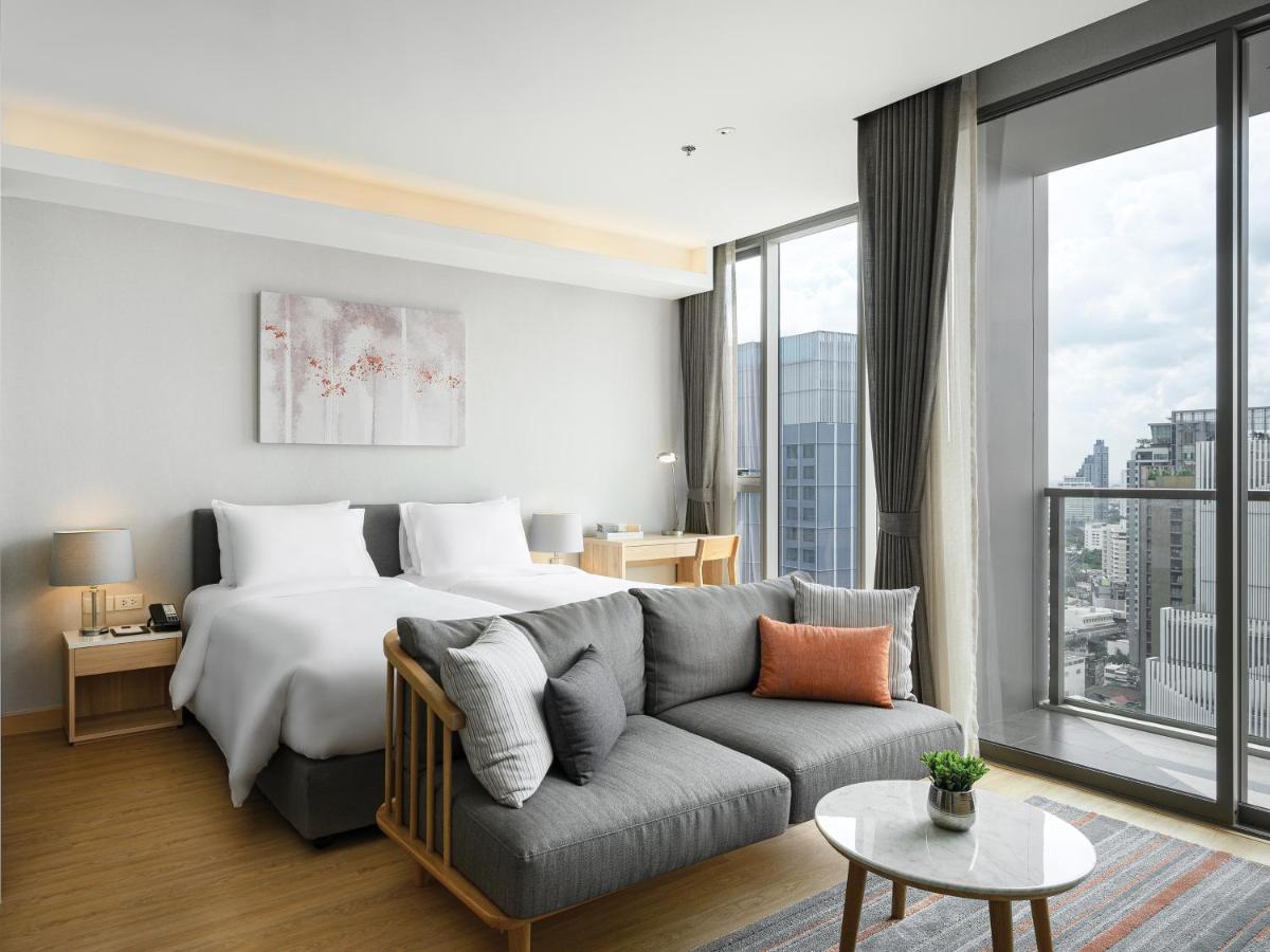 Oakwood Suites Bangkok Banguecoque Exterior foto Deluxe Room