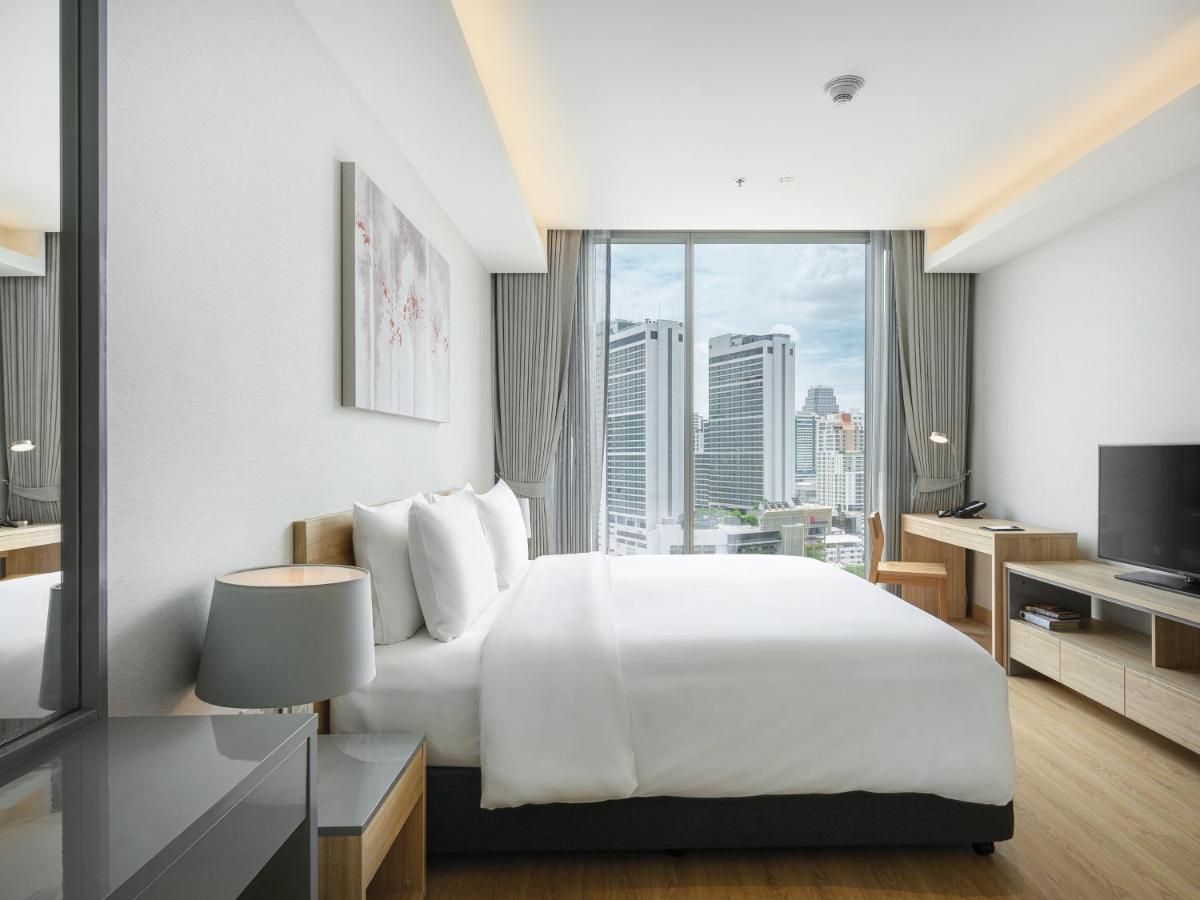 Oakwood Suites Bangkok Banguecoque Exterior foto Bedroom