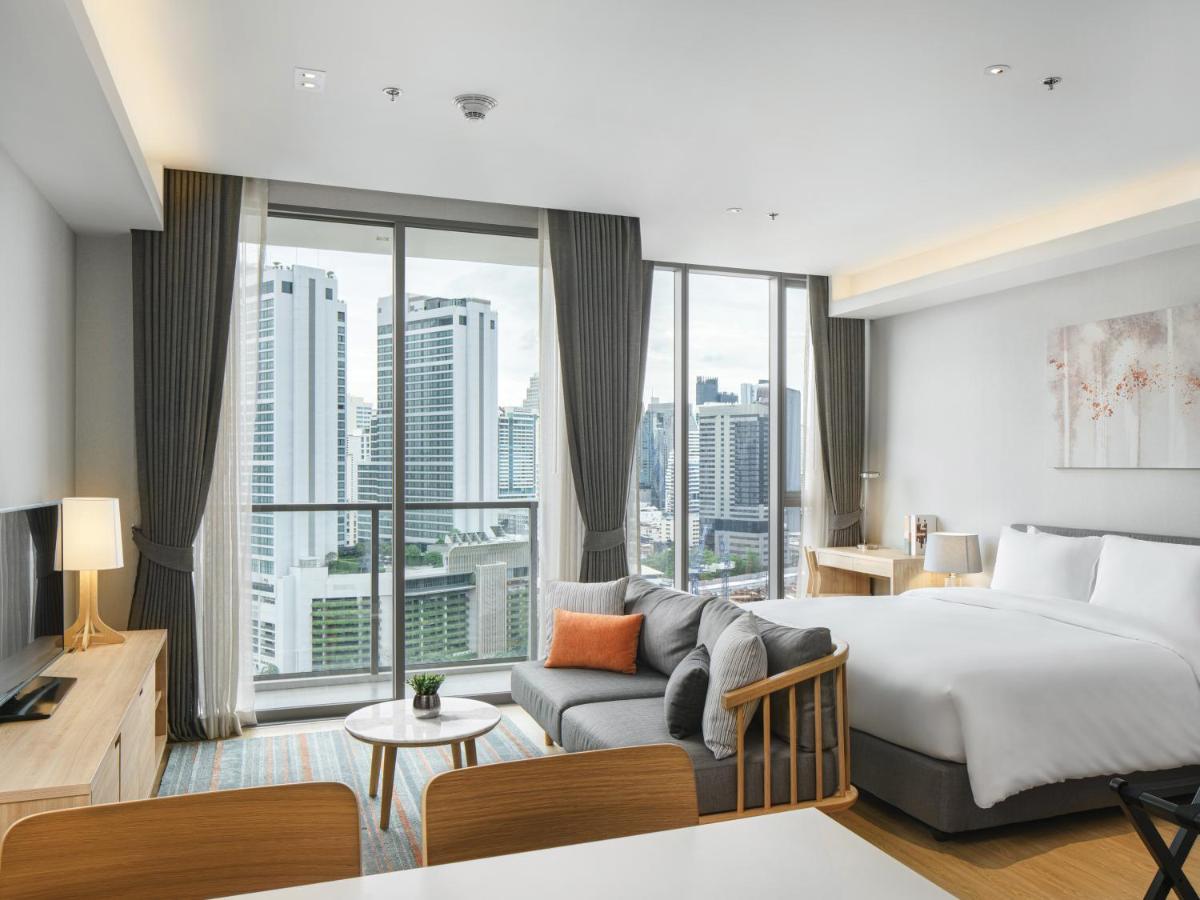 Oakwood Suites Bangkok Banguecoque Exterior foto Deluxe Room