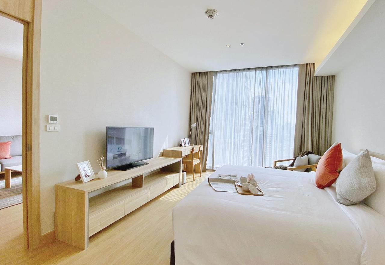 Oakwood Suites Bangkok Banguecoque Exterior foto Deluxe Room