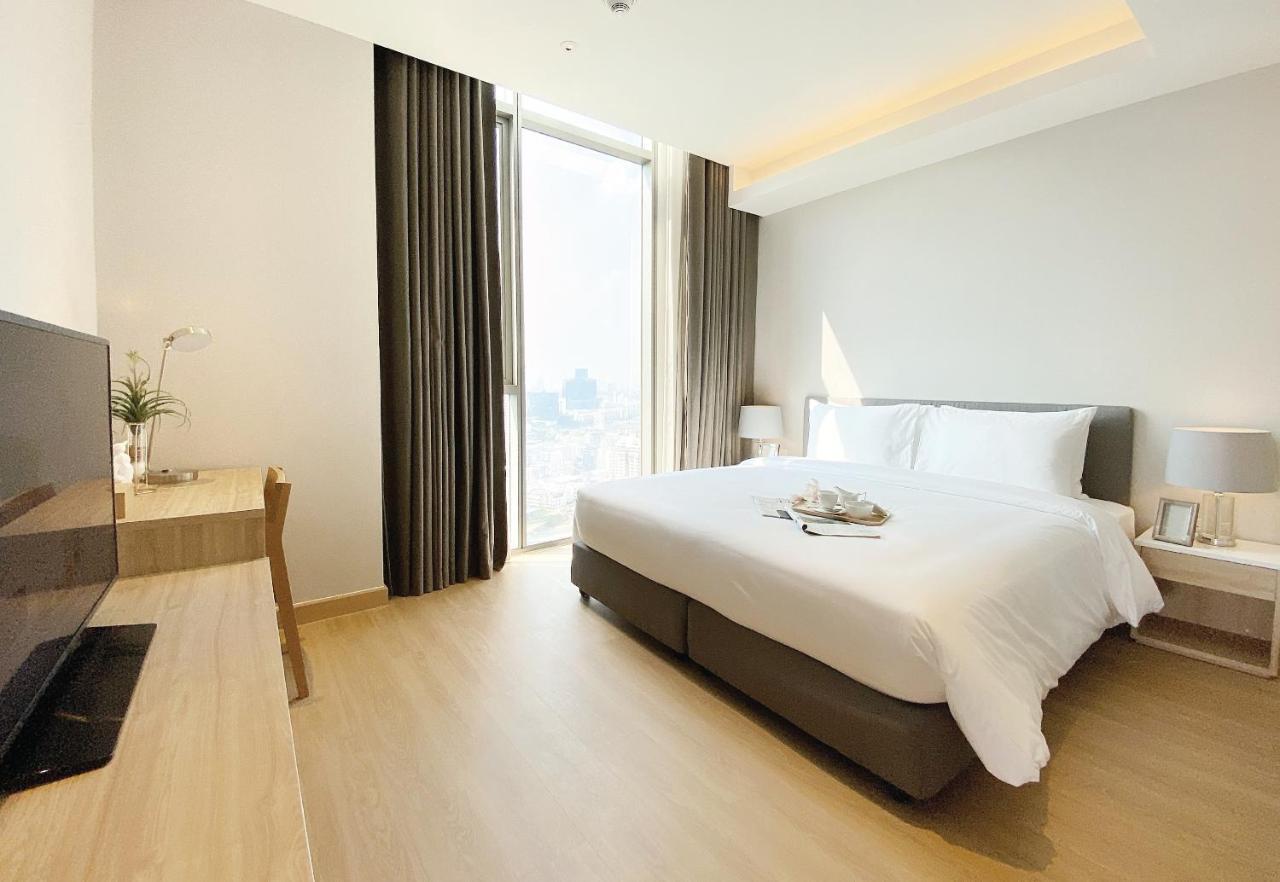 Oakwood Suites Bangkok Banguecoque Exterior foto Deluxe Room